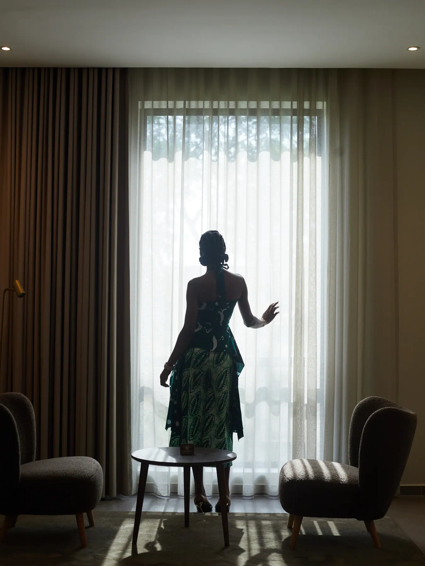 Guest taking in the light from her Abuja room