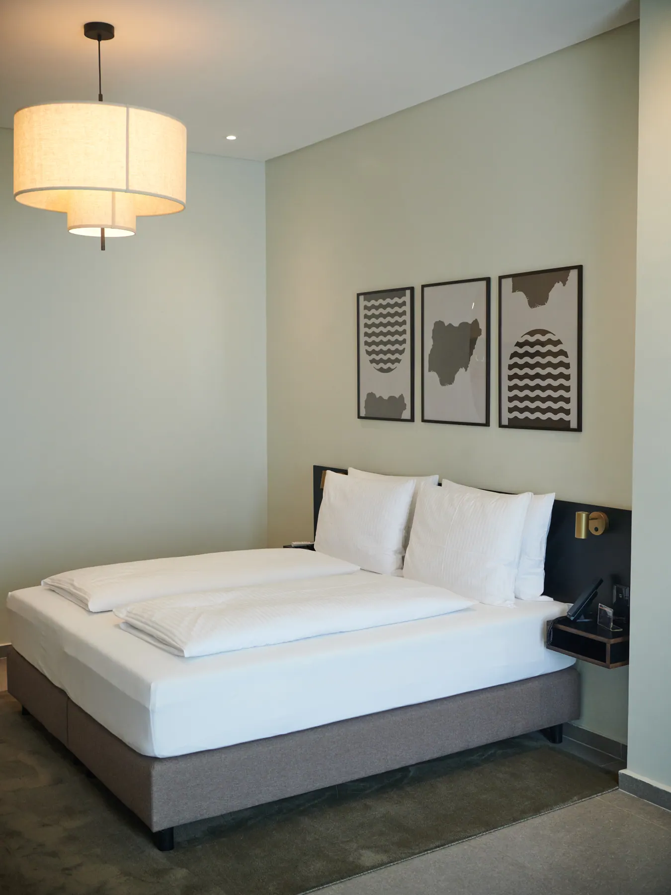 Afro-Nordic art and lighting in an Abuja interior