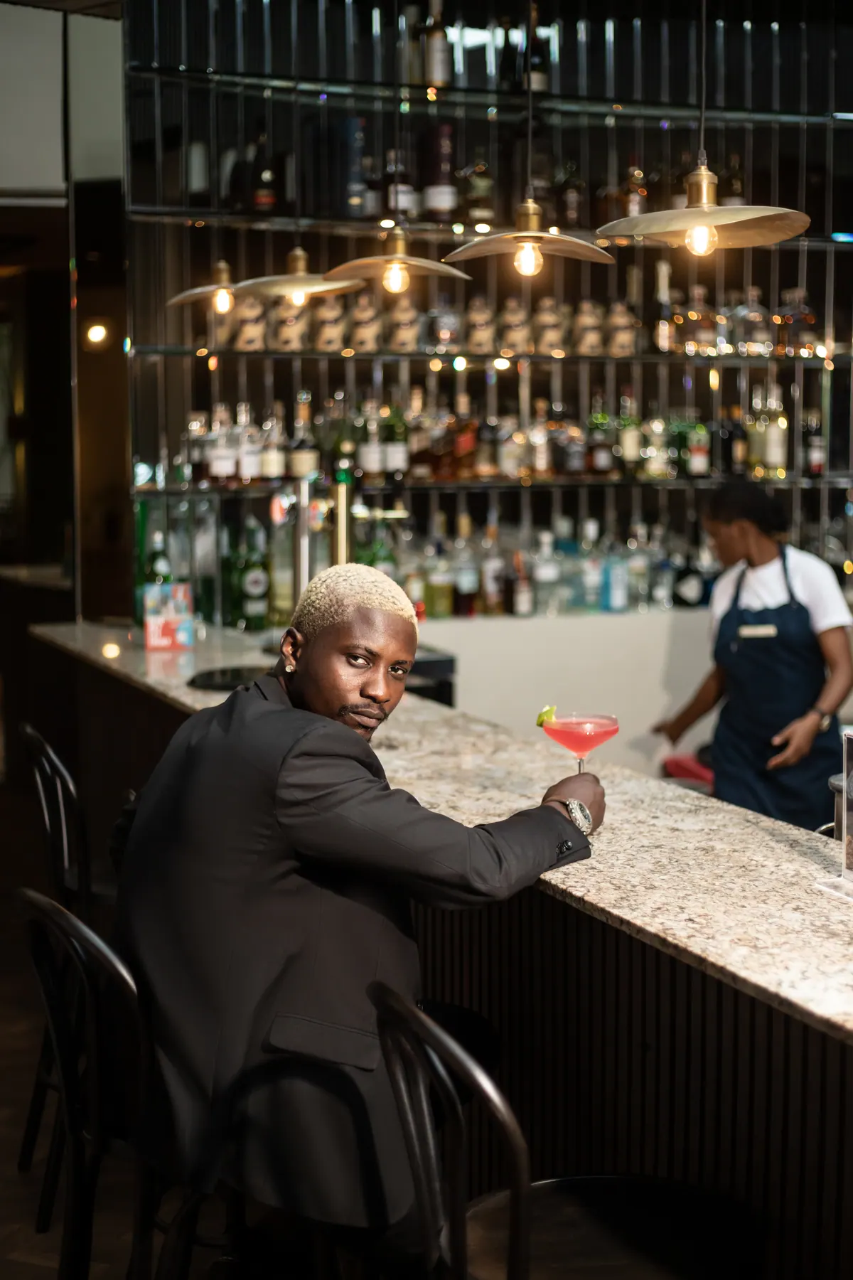 A guest enjoying a cocktail at TARO