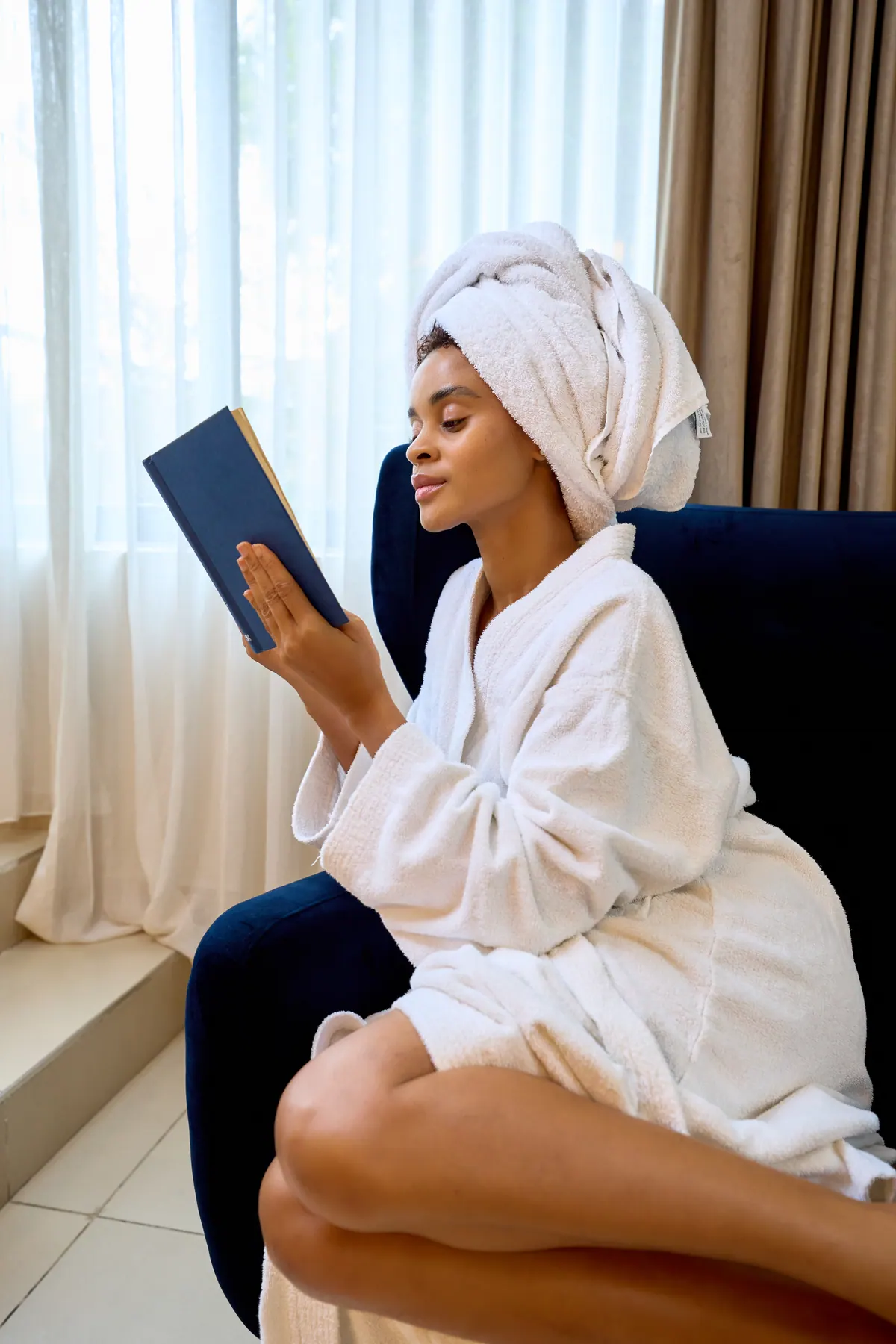 Guest reading in the calm of her Lagos room