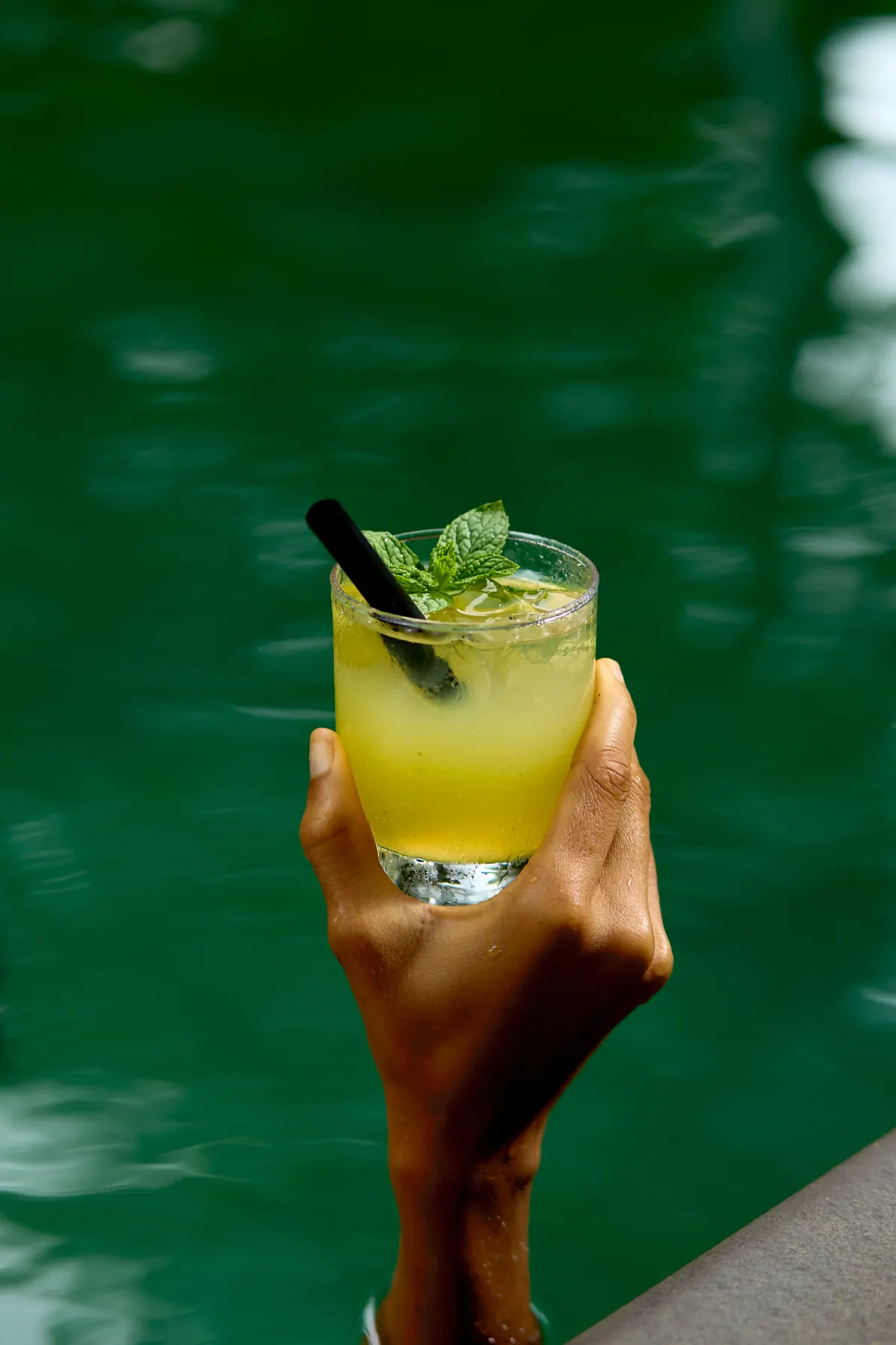 A cooling drink beside the green-tiled Lagos pool