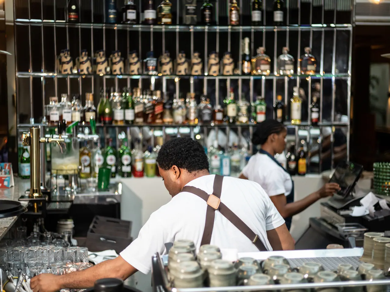 Hospitality team at work behind the bar at The Nordic Abuja